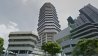 Planon Singapore highrise office concrete with trees.