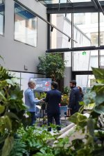 Persons stepping into the office with Planon at IFMA Nordic Workplace 2025