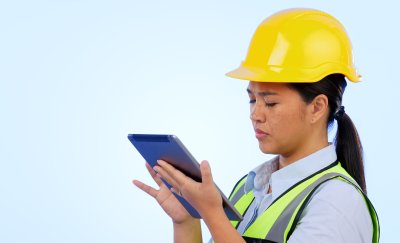 Maintenance women looking at tablet