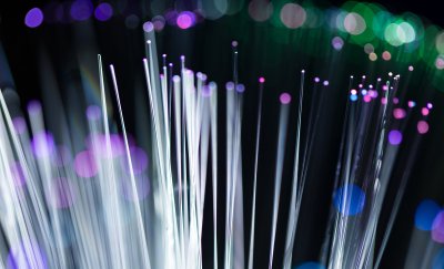 Optical fibers with rainbow colors pointing up.