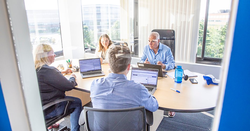 Planon employees in a meeting room