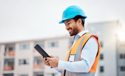 Maintenance engineer looking at a tablet.