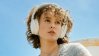 Blond woman with a headset.