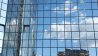 Planon Paris highrise glass office entrance with sky reflection in glass