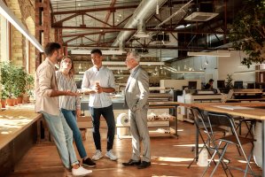 Stand-up of business people in a modern office building.