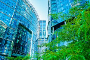 Modern office buildings and trees.