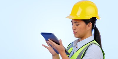 Maintenance women looking at tablet