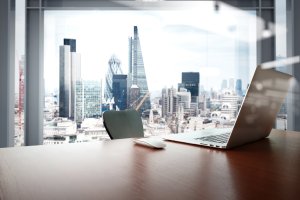 View with laptop and background of city