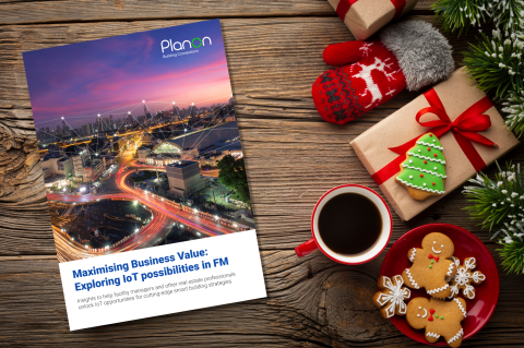 Cover of the "Maximising Business Value: Exploring IoT possibilities in FM" Planon whitepaper surrounded by Christmas decorations