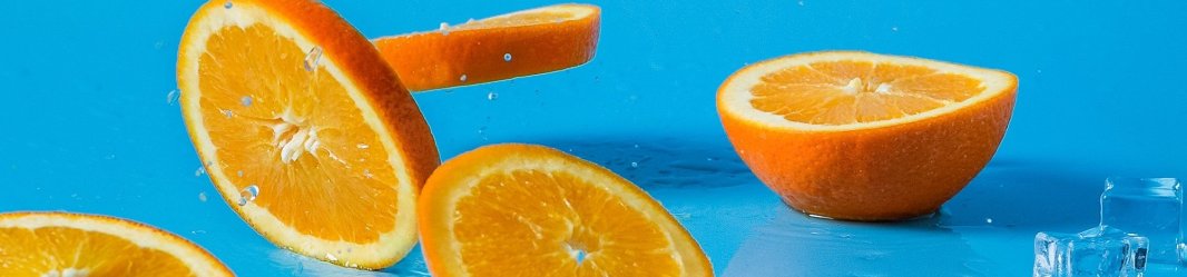 Falling orange slices on blue background.