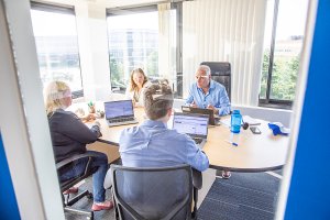 Planon employees in a meeting room