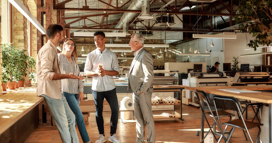 Stand-up of business people in a modern office building.