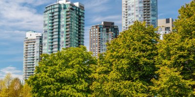 Tall office buildings surrounded by trees.