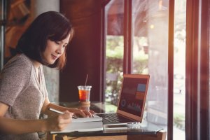 Woman working on her laptop in a nice atmosphere. 