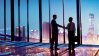 Two businessmen shaking hands in glass office building.