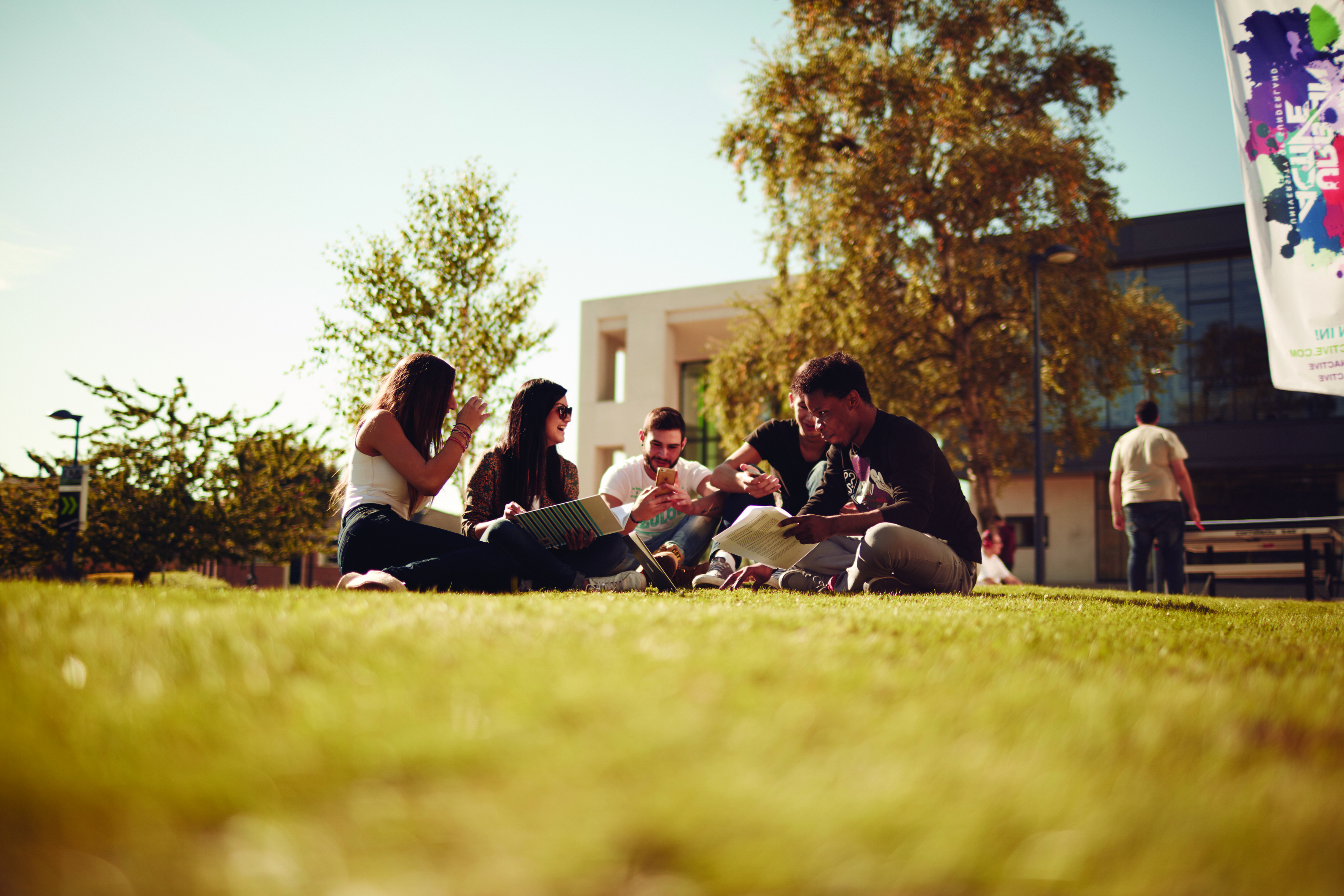 Group of students enjoying free time on a university campus