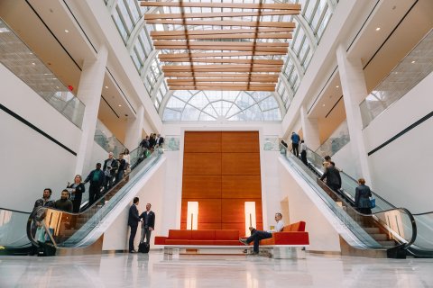 People using the escalators in a well-maintained building.