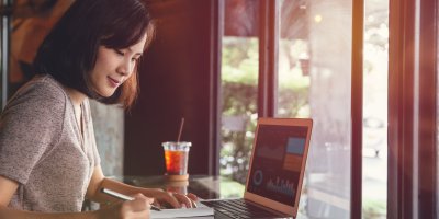 Woman working on her laptop in a nice atmosphere. 