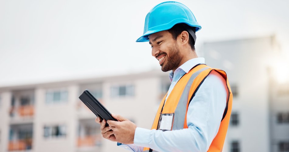 Maintenance engineer looking at a tablet.