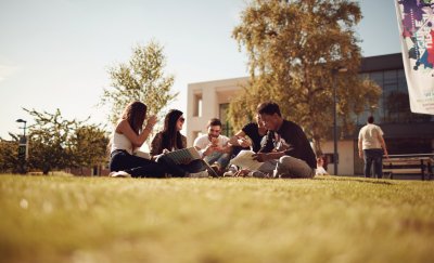Group of students enjoying free time on a university campus