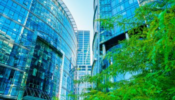 Modern office buildings and trees.