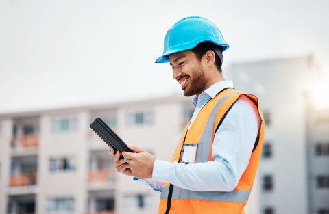 Maintenance engineer looking at a tablet.