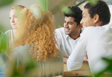 4 people at a table.