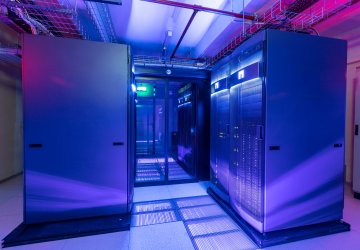 Data center with row full of server racks