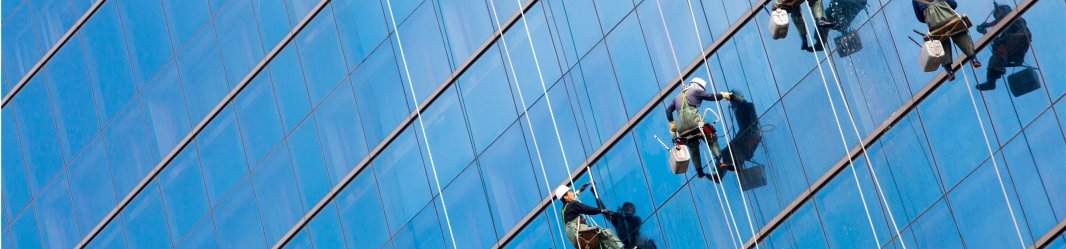 Maintenance employees cleaning the windows