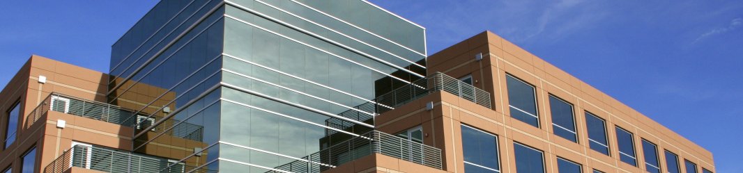 Modern glass low rise office with some orange brick