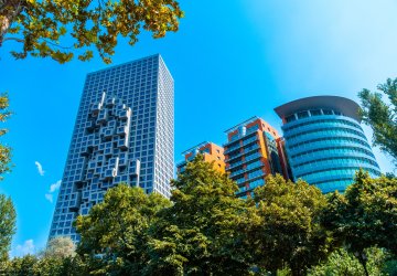 High modern buildings with trees.