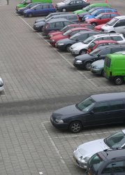 Parking lot with rows of cars