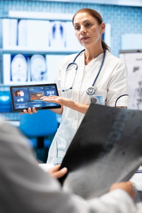 People networking and talking in a trade fair setting.