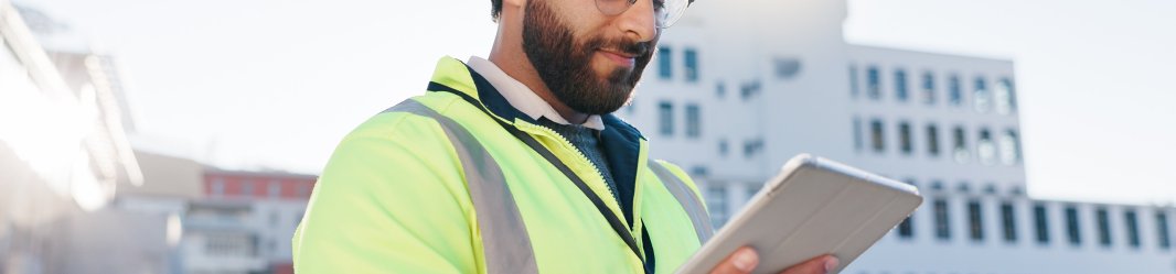 Maintenance man looking at warehouse.