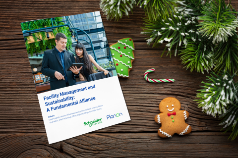 Cover of the "Facility Management & Sustainability: A Fundamental Alliance" Planon e-book surrounded by Christmas decorations.