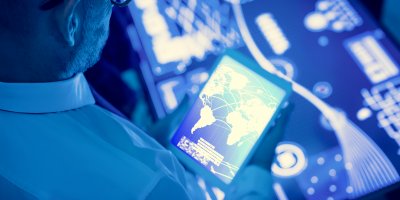 Man holding ipad working with system