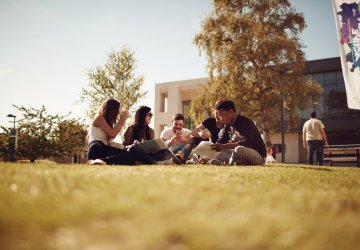 Group of students enjoying free time on a university campus