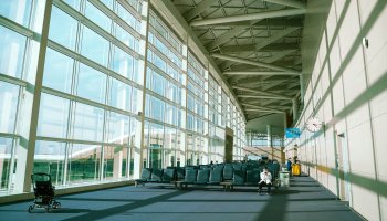 People in the departure hall of an airport