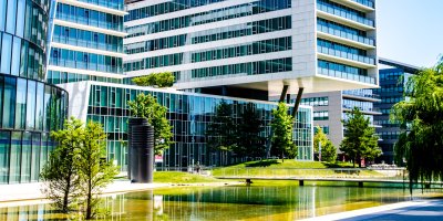 Modern office building in green surroundings.