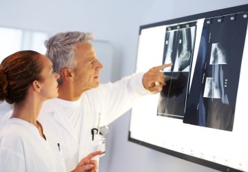 Healthcare - two doctors looking at a xray