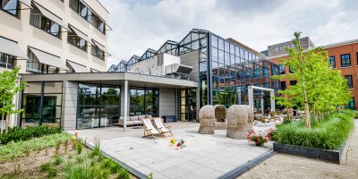 Planon campus with office buildings, greenhouse and garden.