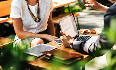 Employees discussing in sustainable workspace