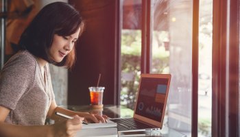 Woman working on her laptop in a nice atmosphere.