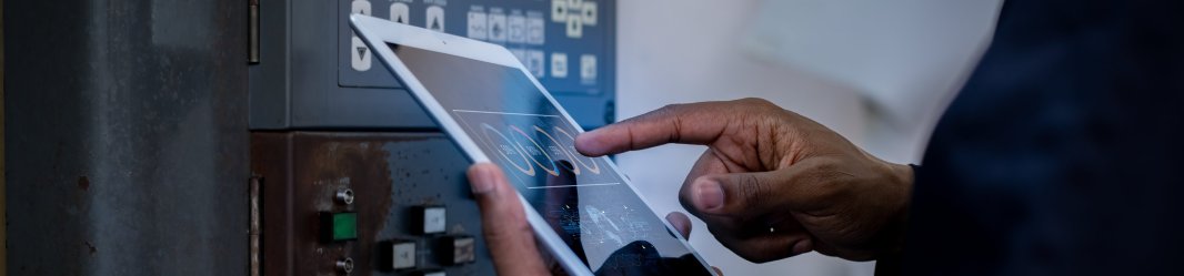 Engineer on tablet doing maintenance management