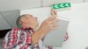 Man checking emergency signs in building