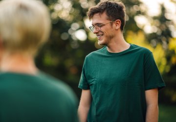 Man outside in green shirt.