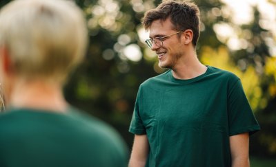 Man outside in green shirt.
