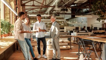 Stand-up of business people in a modern office building.