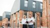 Young business colleagues in front of real estate buildings