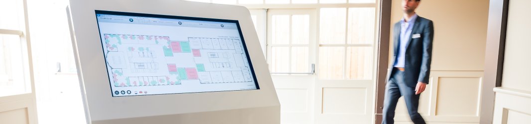 Kiosk with a floor plan of a building.